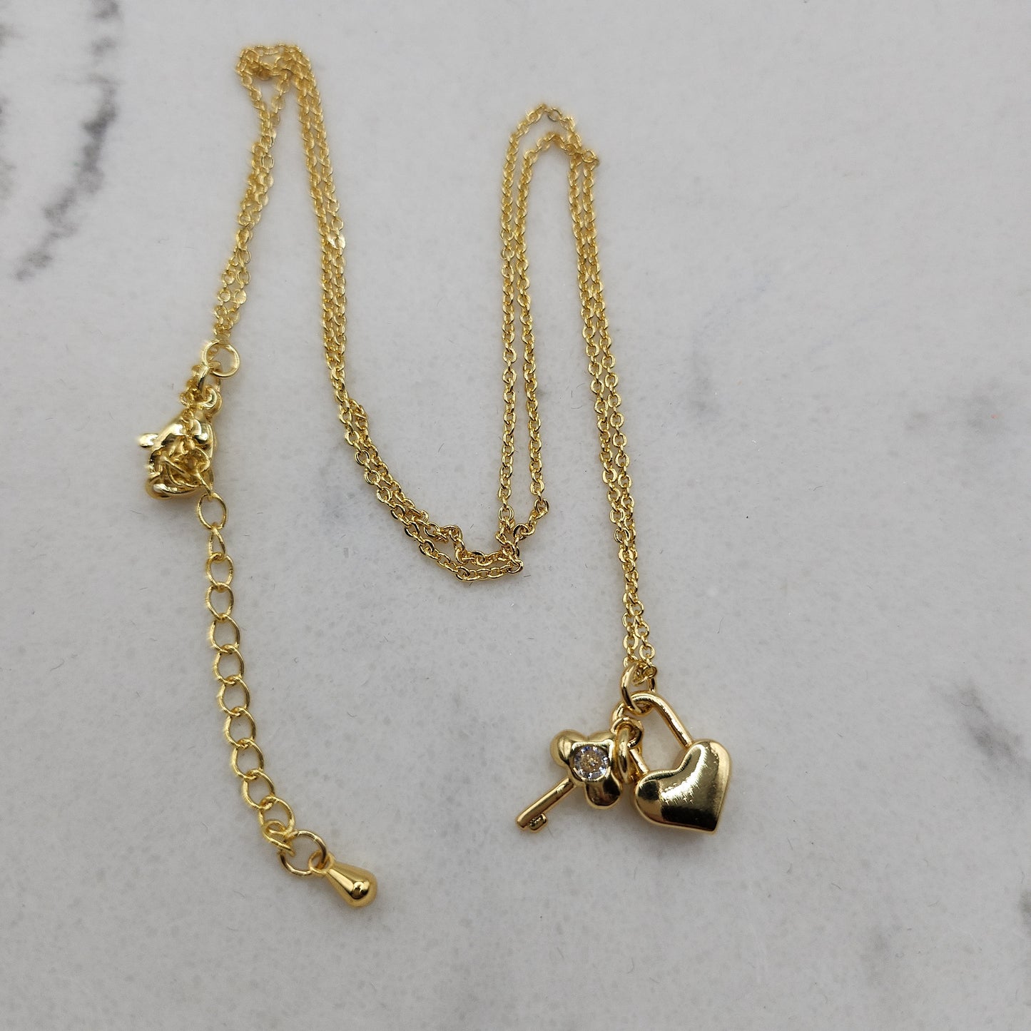Heart and key gold necklace